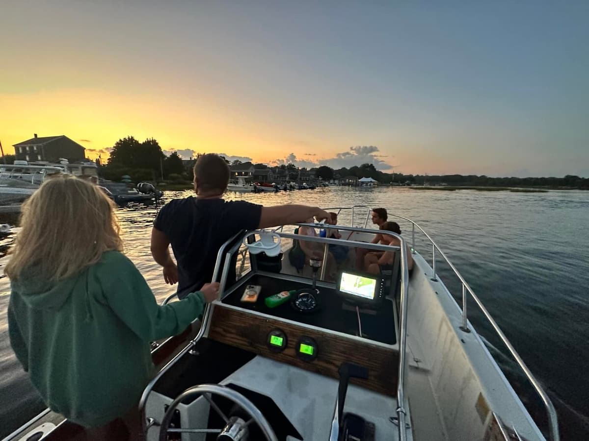 Pulling into the dock at golden hour, village behind
