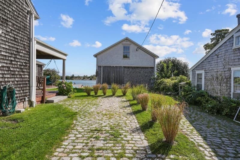 Cobblestone pathway to the boathouse at 2042 Main Road, Westport Point