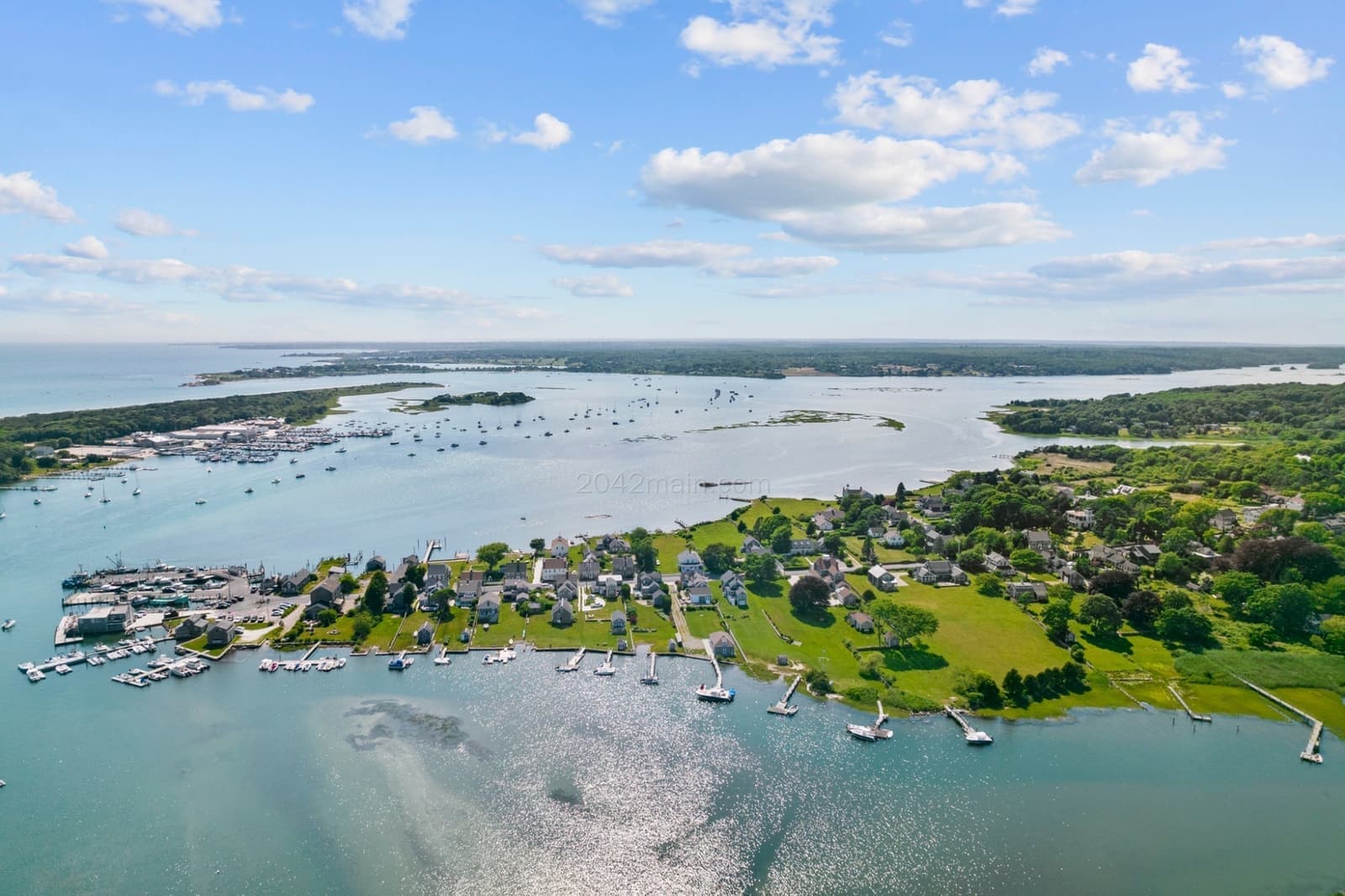 Wide aerial view of Westport Point, harbor, and river from above